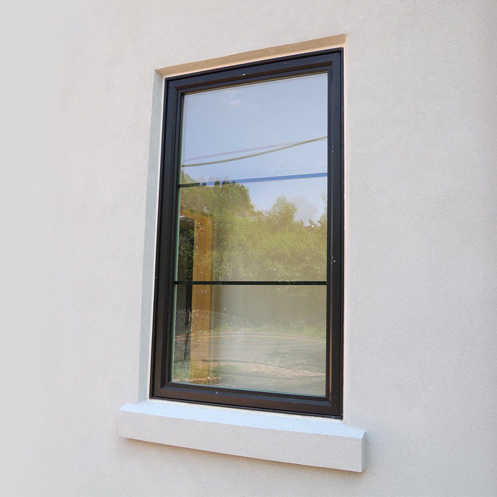 A recessed window sealed with liquid flashing
