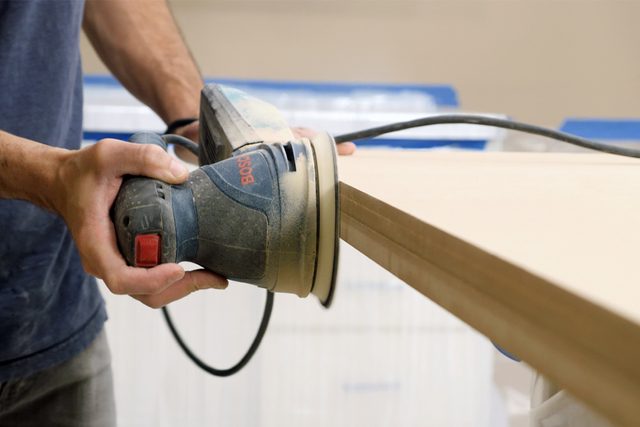 Sanding the wooden table