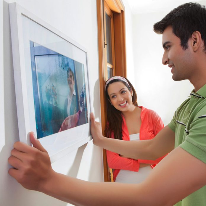 hanging picture on wall