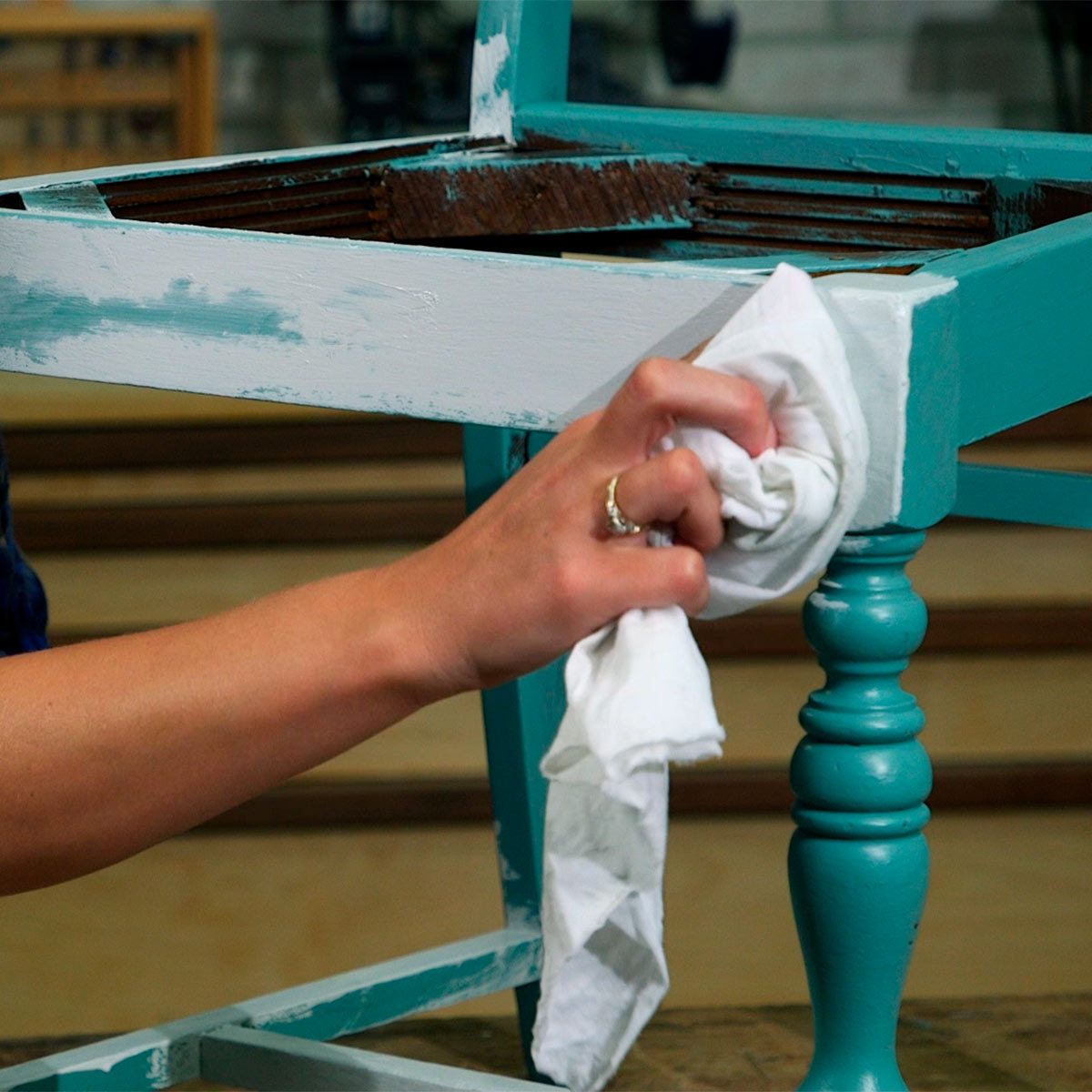 paint second layer on chair and remove some to reveal aged look