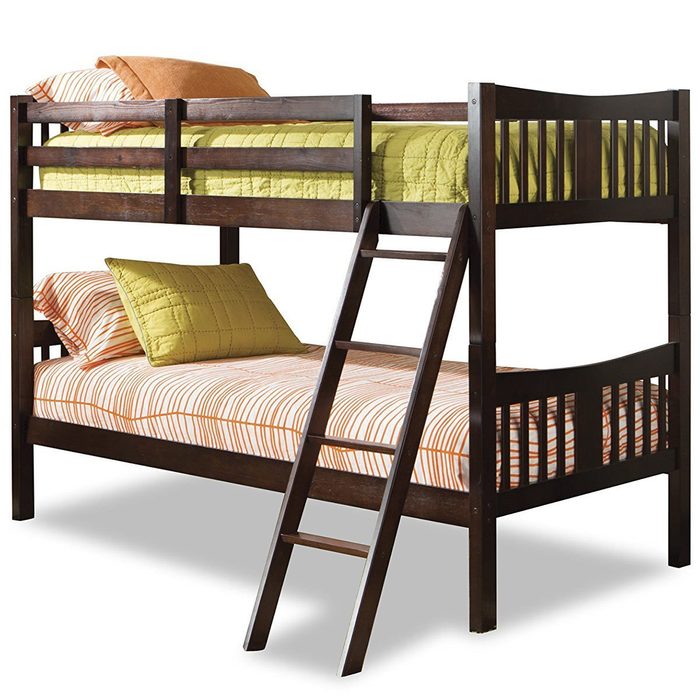 A wooden bunk bed with a ladder stands in a simple setting. The top mattress is covered with a green quilt, while striped bedding adorns the bottom.