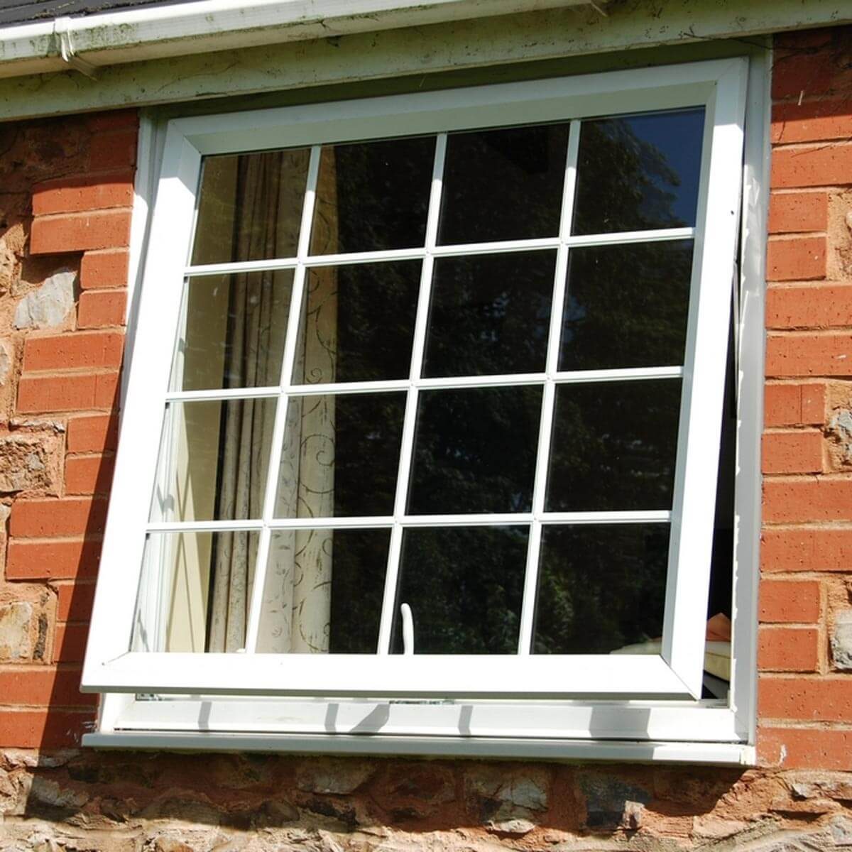 dfh7_shutterstock_19074904 open window brick house