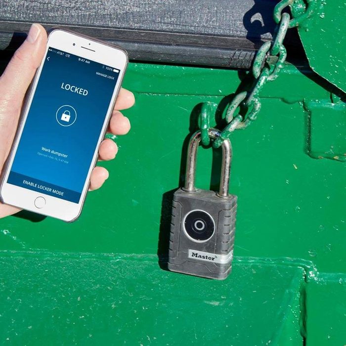 A hand holds a smartphone displaying a 