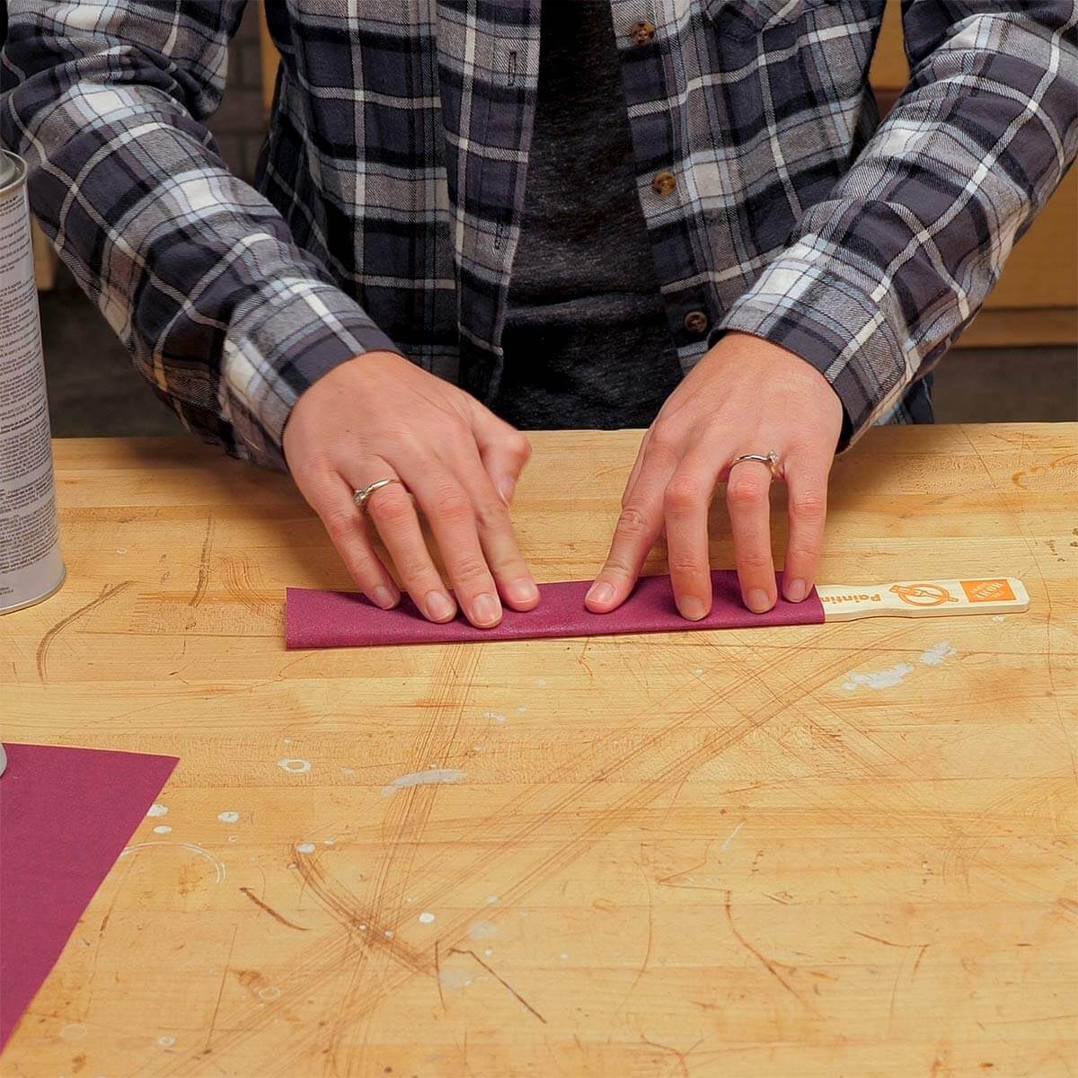 wrapping sandpaper around paint stick