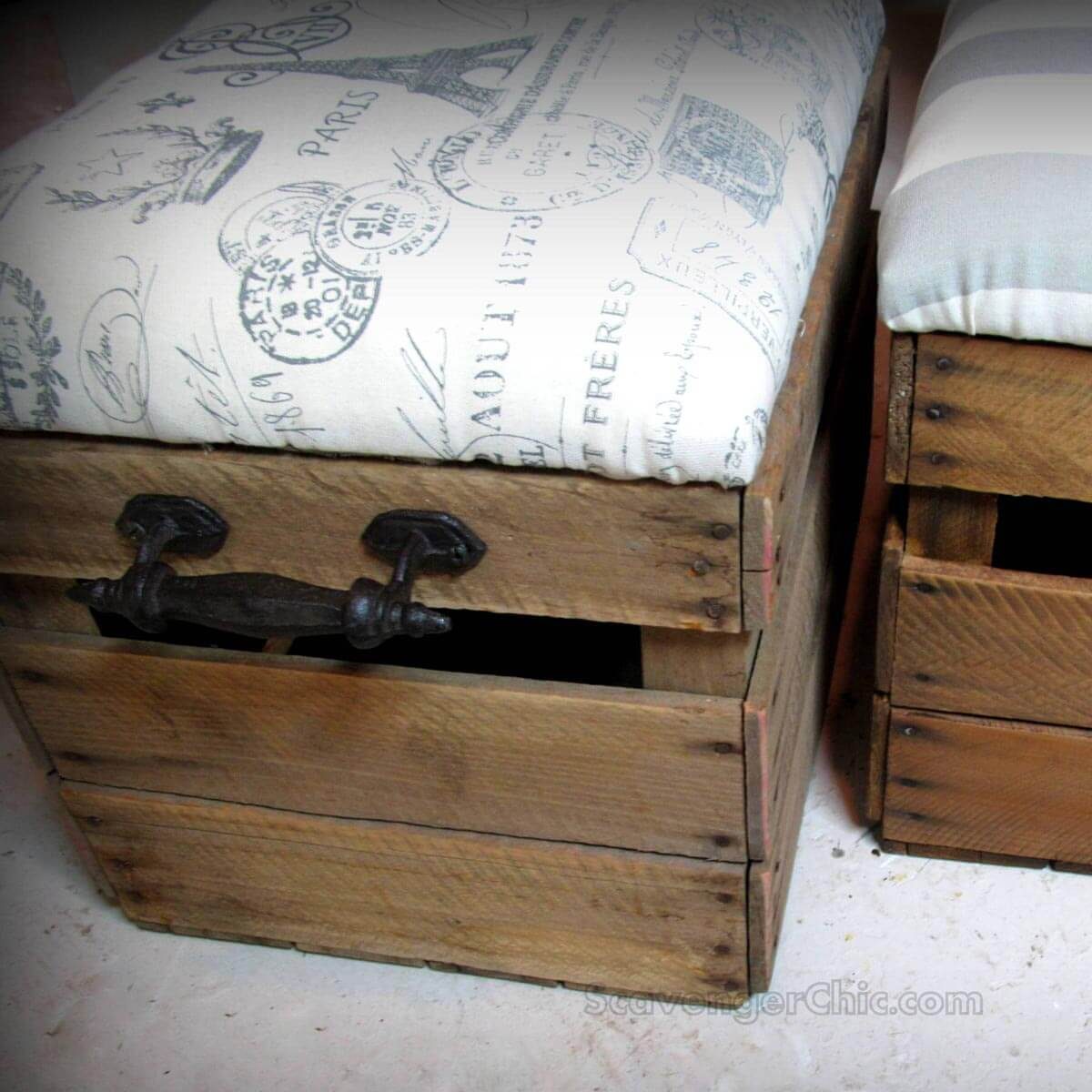 A wooden storage box with a fabric cushion sits in a room, displaying vintage print patterns, while another similar box is positioned nearby.