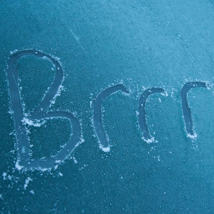 A frosty surface displays the word