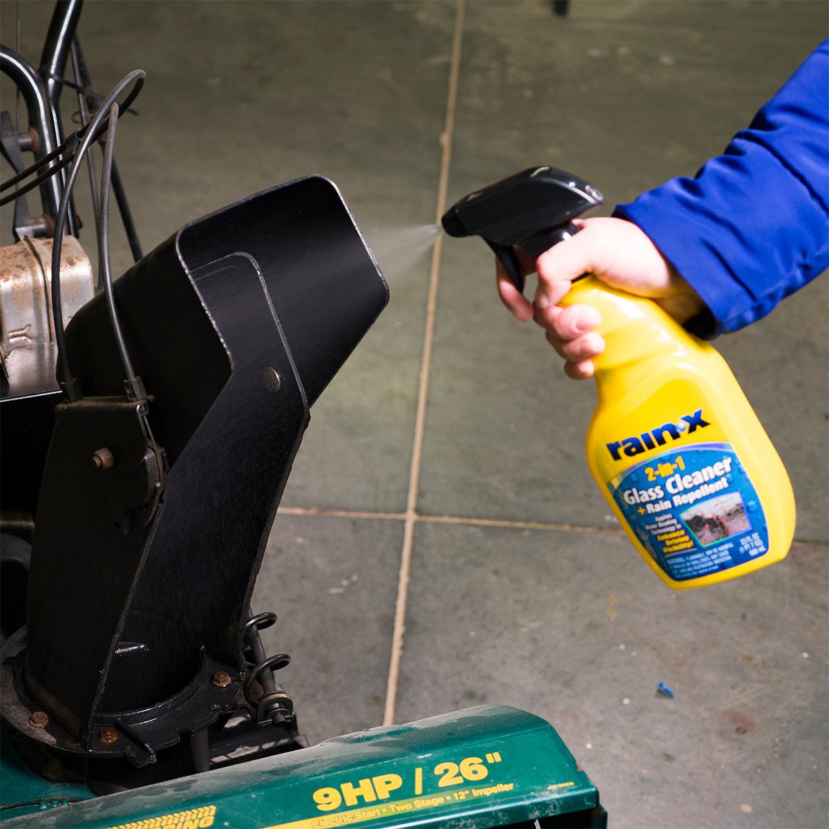 spraying rain-x inside snowthrower chute