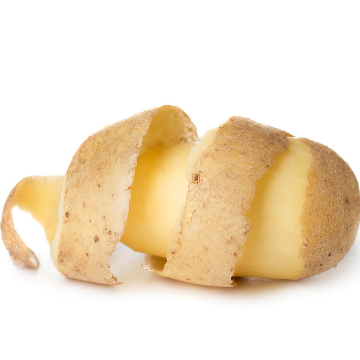 A potato partially peeled, with curling skin revealing its white flesh, rests on a plain white surface, highlighting its texture and form.