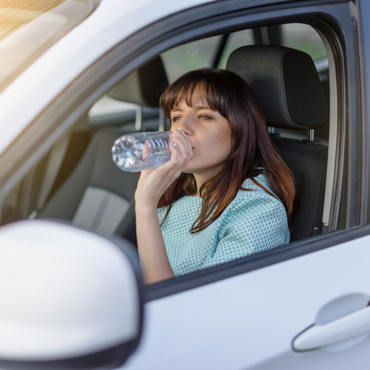 drinking water in car