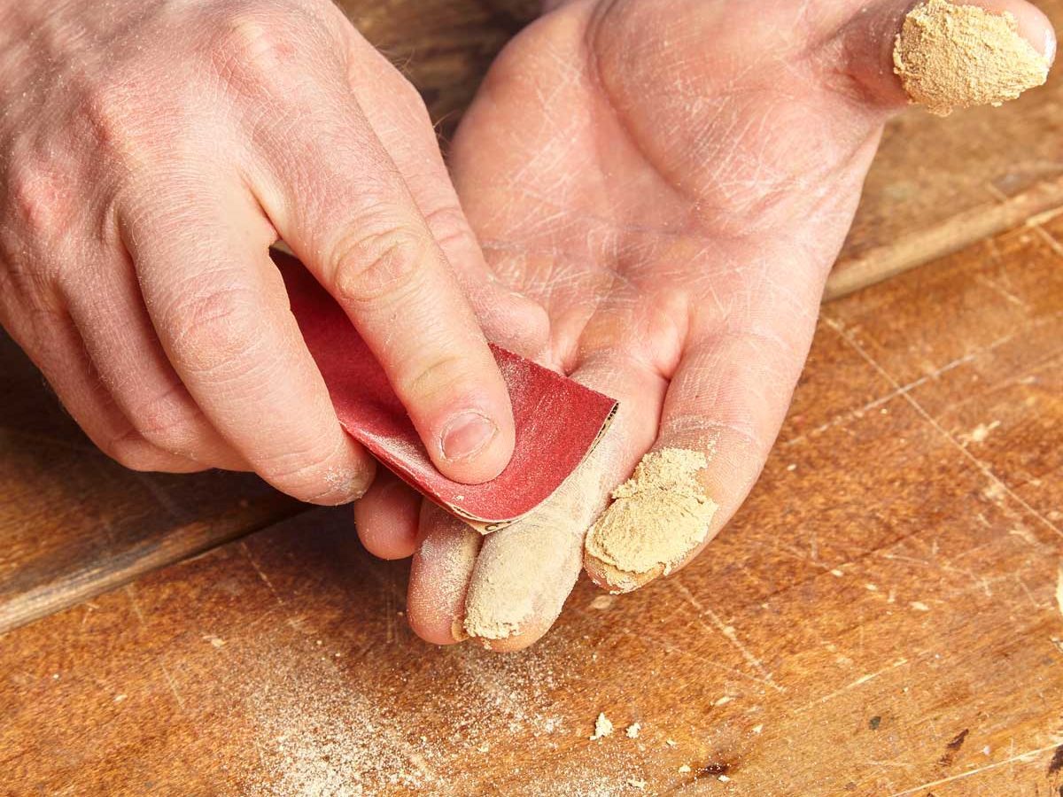 remove super glue with sandpaper