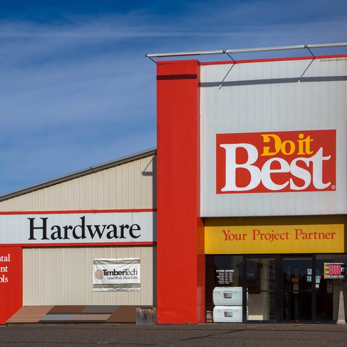 A hardware store displays large, colorful signage. 