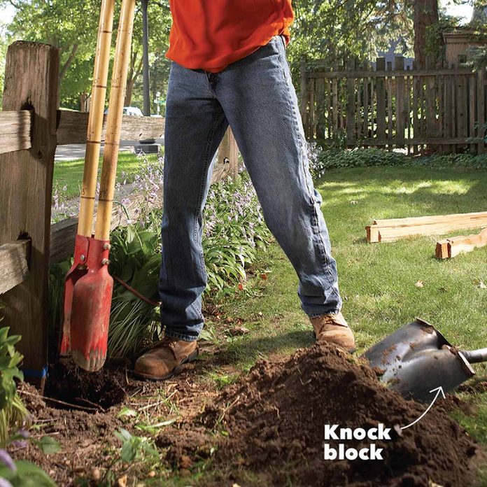 digging a hole clamshell digger