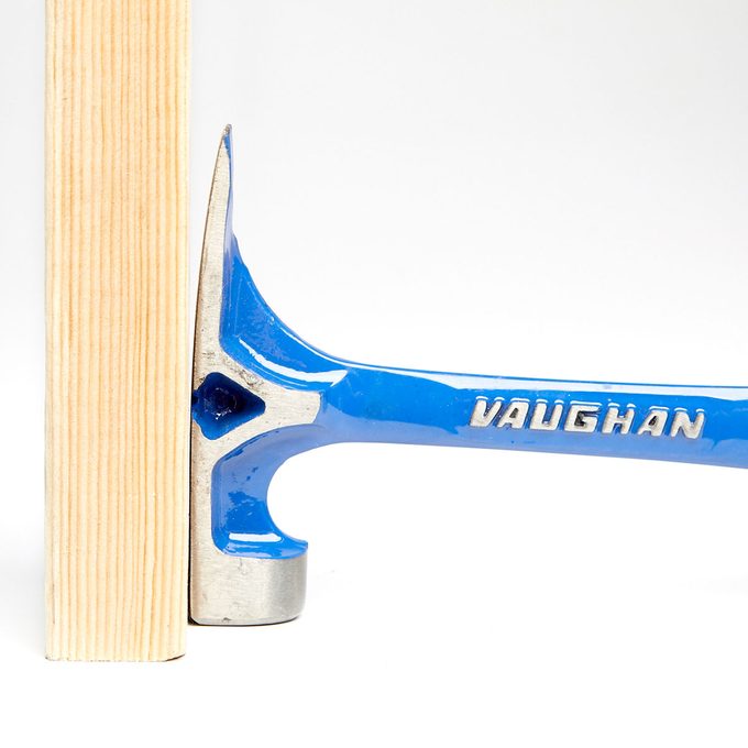 A flat hammer head top A flat hammer head top pushed against wood| Construction Pro Tips