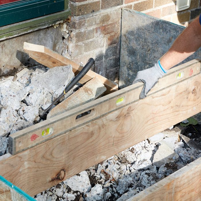 Checking to make sure the step forms are level | Construction Pro Tips