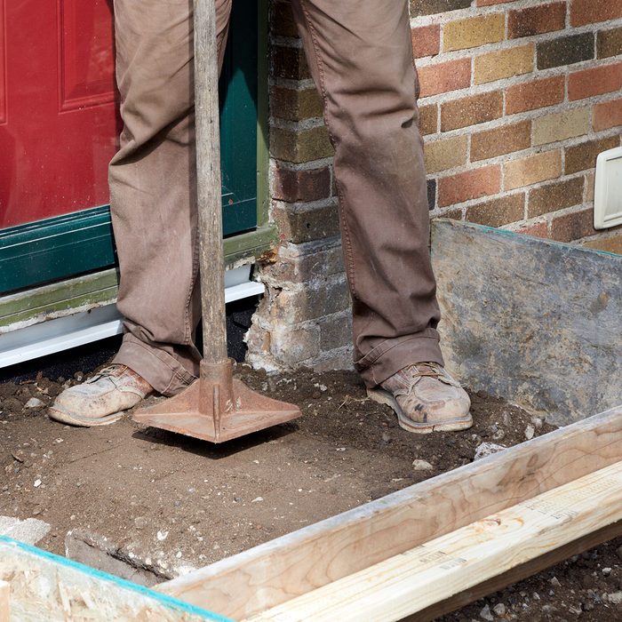 Tamping down the loose fill | Construction Pro Tips