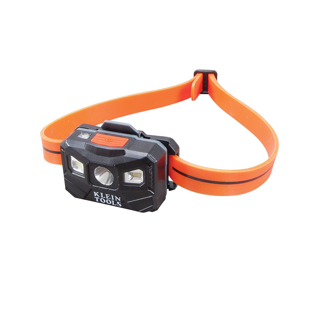 A black headlamp with two white LED lights is resting on an orange elastic band, designed for hands-free illumination in dark environments.