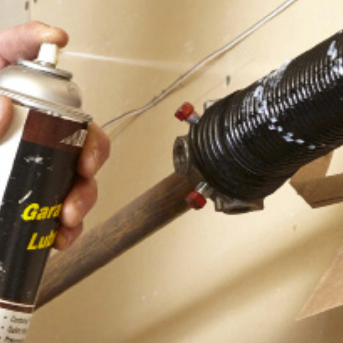 Lubricate the garage door spring