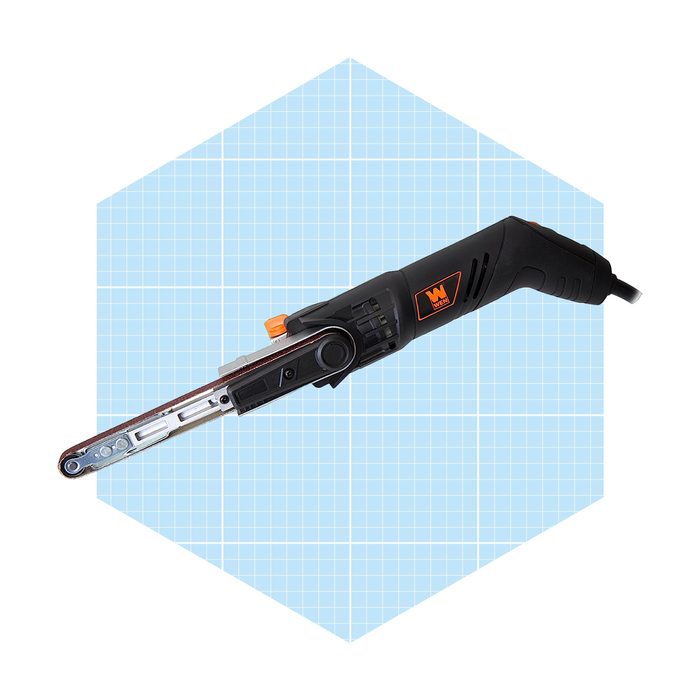 A power sander is positioned at an angle, actively smoothing surfaces. It rests against a light blue grid background, emphasizing its design and function.