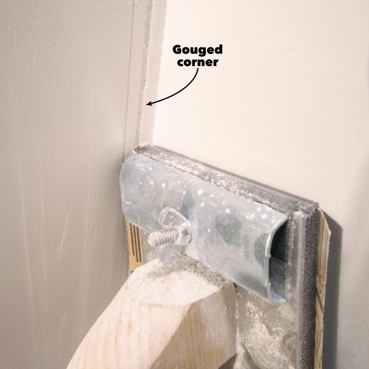 A metal corner guard is attached to a wall, showing a gouged corner with dust and debris. An arrow points to the damaged area labeled "Gouged corner."