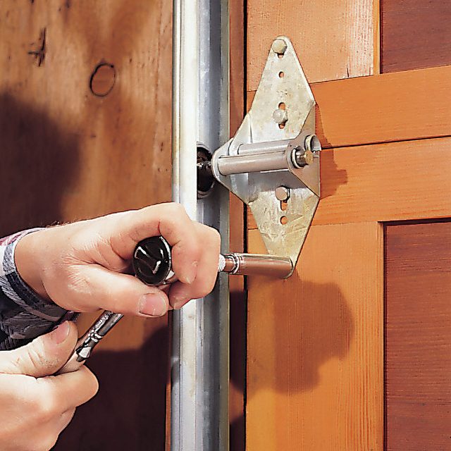 a man tightening the nuts and bolts