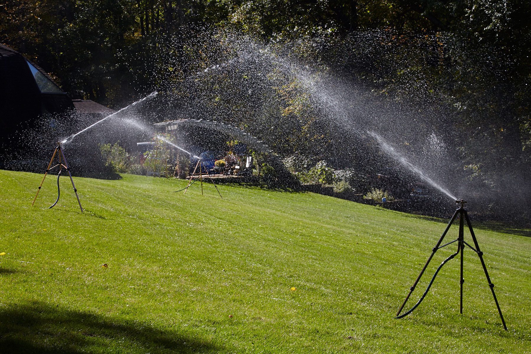 Sprinkler on tripod in lawn