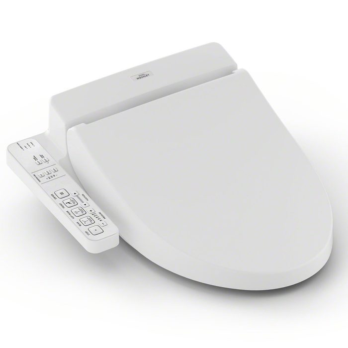 A white bidet attachment is positioned beside a toilet, featuring control buttons for various functions to enhance personal hygiene in a bathroom setting.