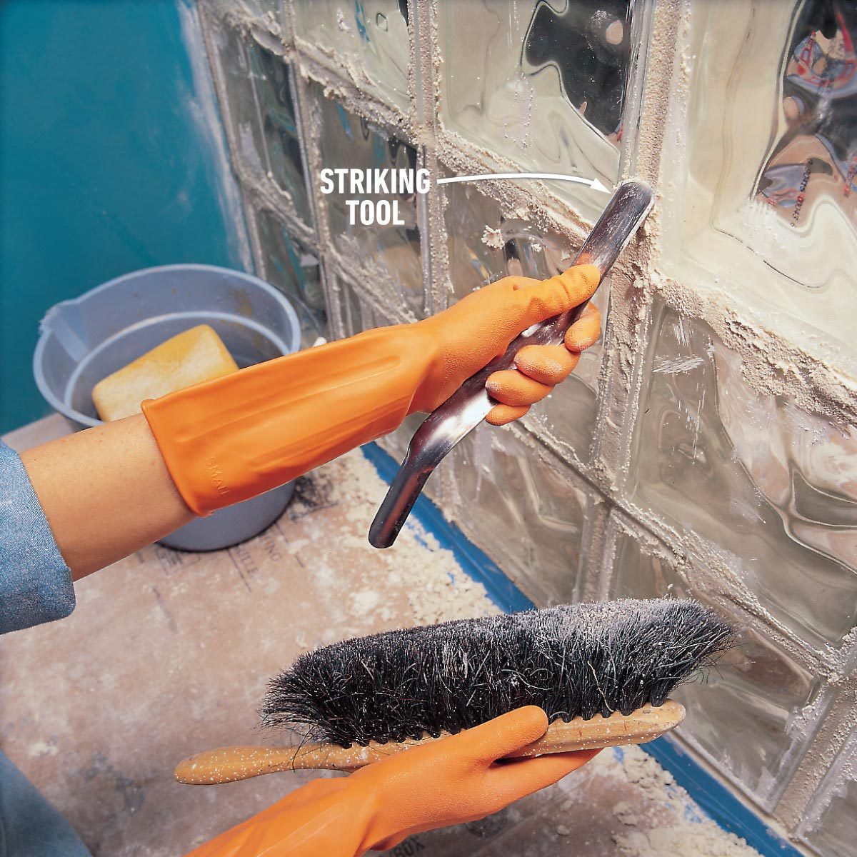 striking the joints to install a glass block shower