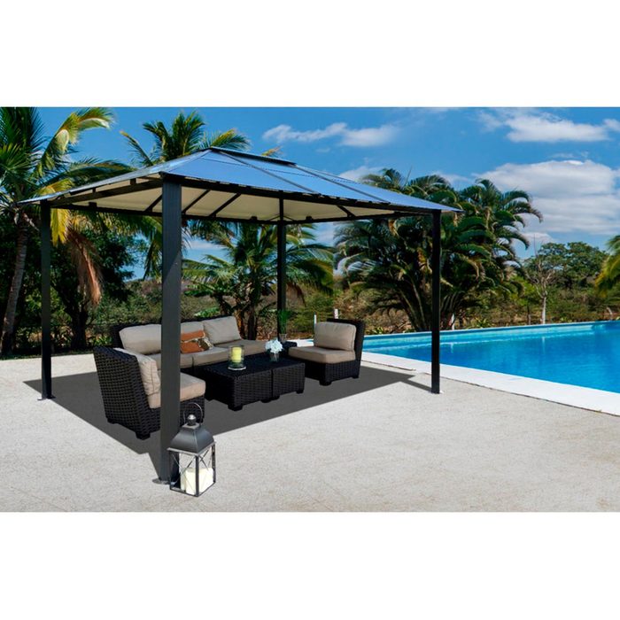 A gazebo with comfortable seating surrounds a small table, set near a clear swimming pool and lush palm trees under a bright sky.