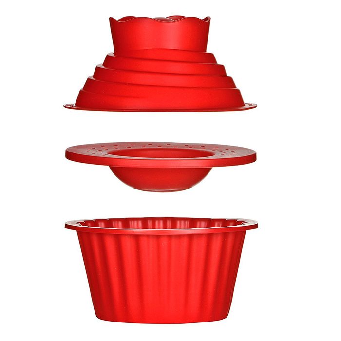 A stack of red silicone baking molds displays various shapes, including a fluted circular base, a bowl, and a lid, organized vertically.