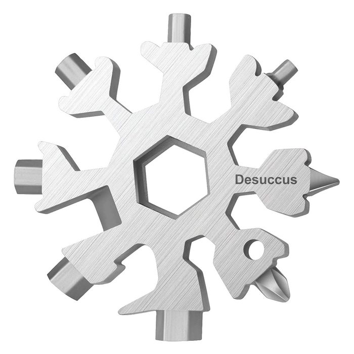 A snowflake-shaped multi-tool features various tool ends, including hex and screwdriver tips, designed for versatility and functionality in compact form.