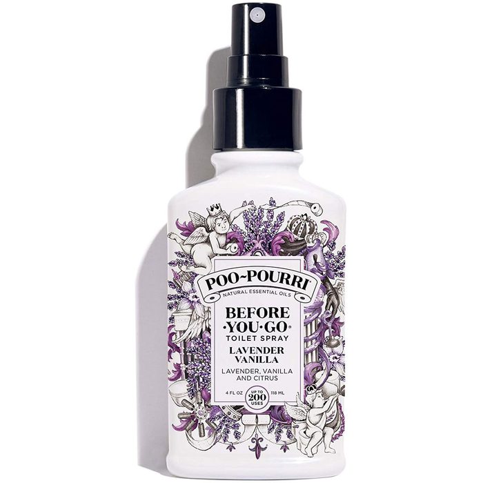 A white spray bottle with a black nozzle emits a fragrant mist. It features decorative lavender and vanilla illustrations, labeled for toilet use.