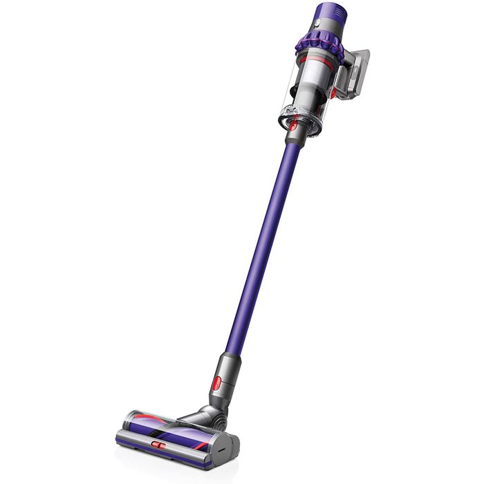 A cordless vacuum cleaner stands upright, with a long handle and a brush head, designed for cleaning various surfaces in home environments.