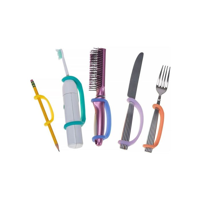 A pencil, toothbrush, comb, knife, and fork are held by colorful grip bands, designed to assist users in holding various utensils comfortably.