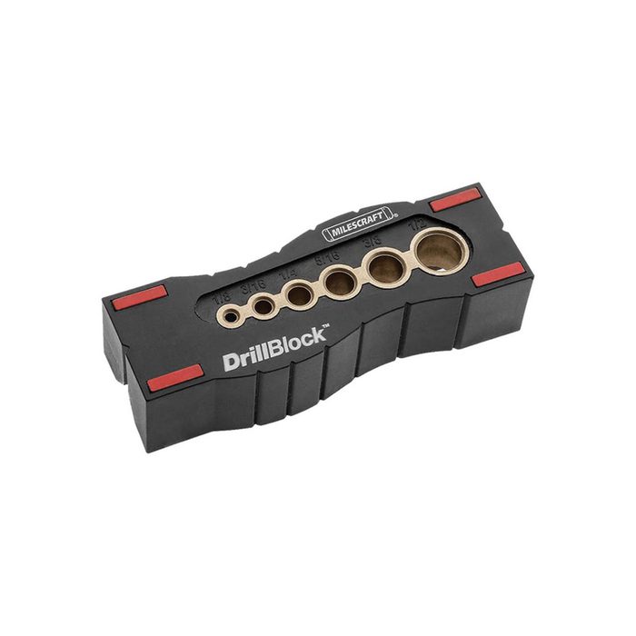 A black, rectangular drill guide with multiple sized holes for precise drilling, designed for woodworking tasks, featuring red accents and the label 