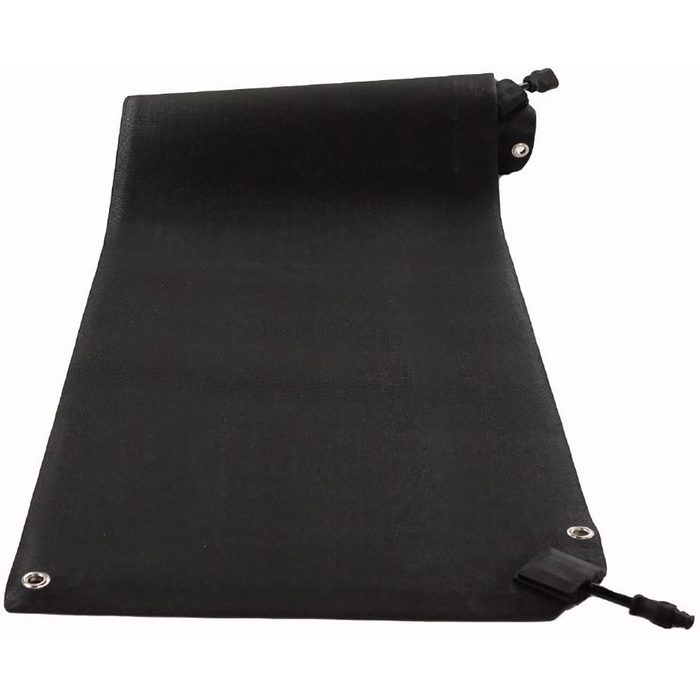 A black mat lies flat on a surface, partially rolled at one end, displaying metal grommets and a cord attachment for securing or adjusting tension.