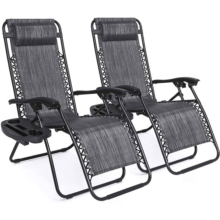 Two reclining chairs in black and gray are positioned side by side, each featuring armrests and adjustable headrests, ideal for outdoor relaxation.