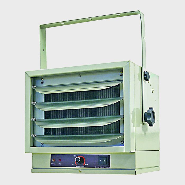 A wall-mounted heater with adjustable slats emits warm air, controlled by a dial and switch, designed for indoor temperature regulation.