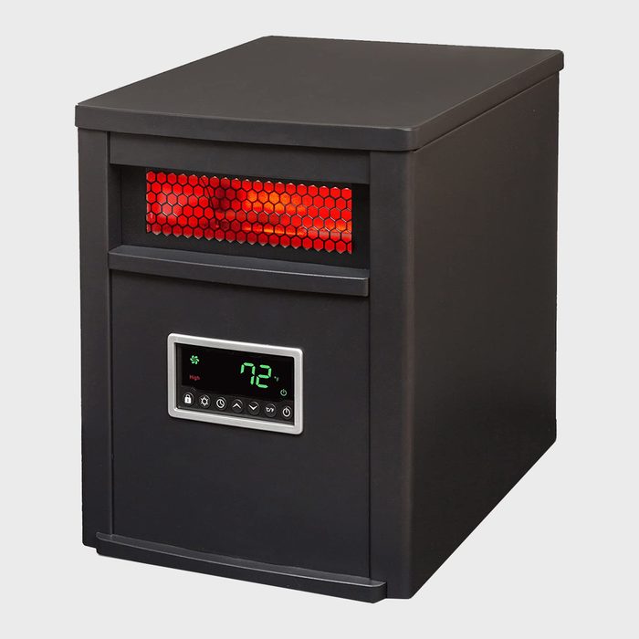 A black heater displays red glowing elements while showing a digital temperature reading of 72°F on its front panel. It sits on a plain background.