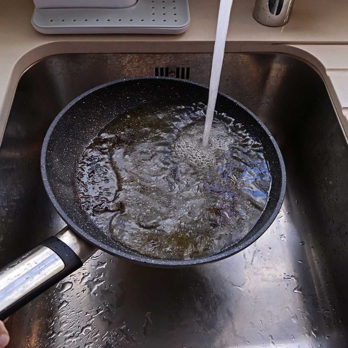 Pouring grease down the drain