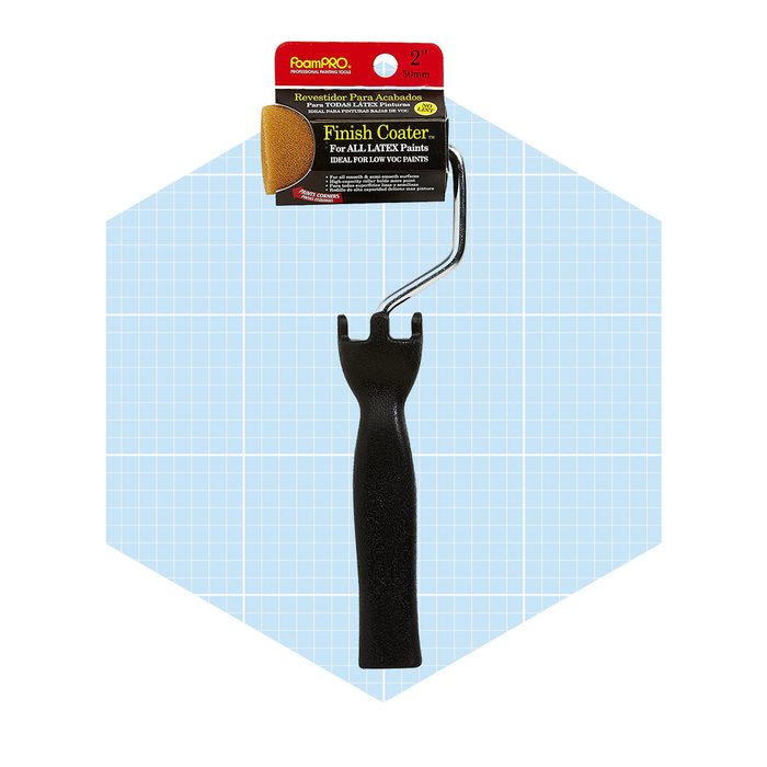 A 2-inch paint roller with a black handle and yellow foam cover, intended for applying latex paints, is displayed against a light blue grid background.