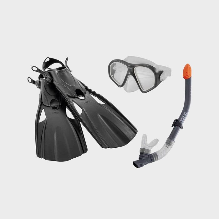 A set of snorkeling gear includes black fins, a clear mask with black edges, and a gray snorkel with an orange tip, arranged on a light background.