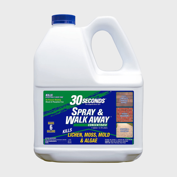 A white plastic jug with a blue cap contains a cleaning concentrate labeled 