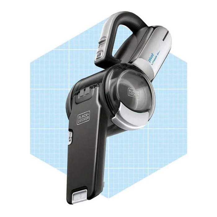 A handheld vacuum cleaner is positioned against a light blue grid background, designed for easy maneuverability and efficient cleaning in small spaces.