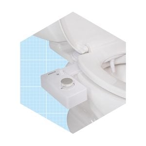A bidet attachment is mounted on a white toilet, allowing users to adjust water flow with a knob. The background features a light blue grid pattern.