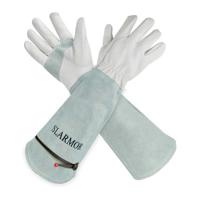 A pair of long leather gloves lies flat, showcasing a greenish-blue suede and white leather combination, suitable for protective tasks in various environments.