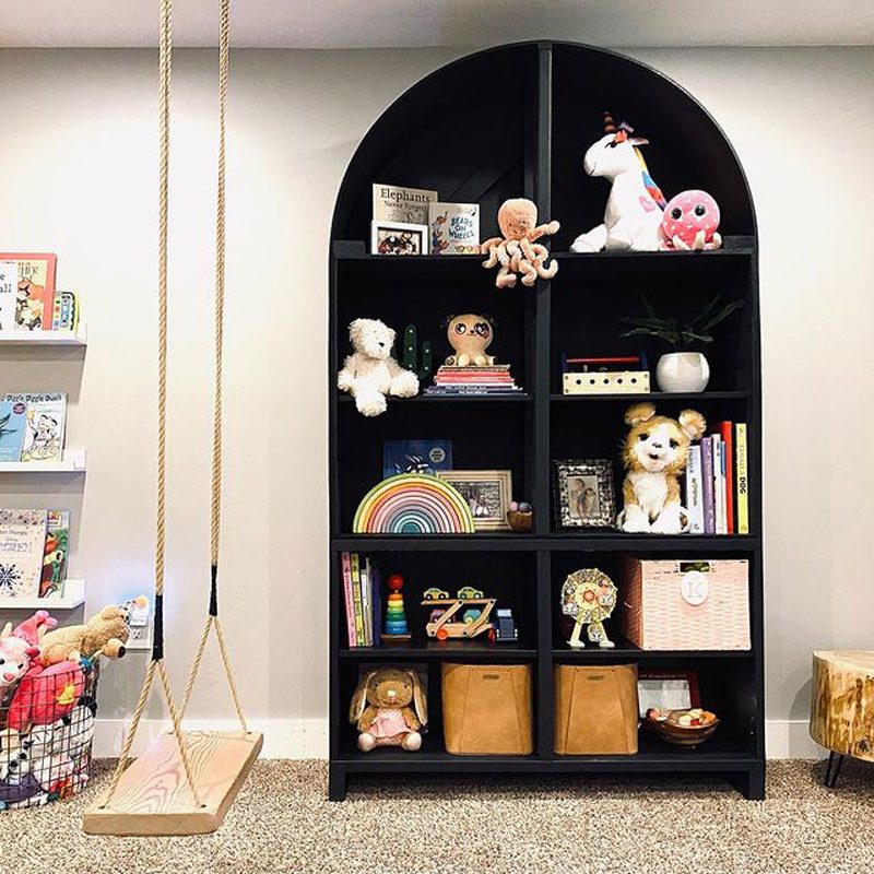 Arched basement shelf in black to store children