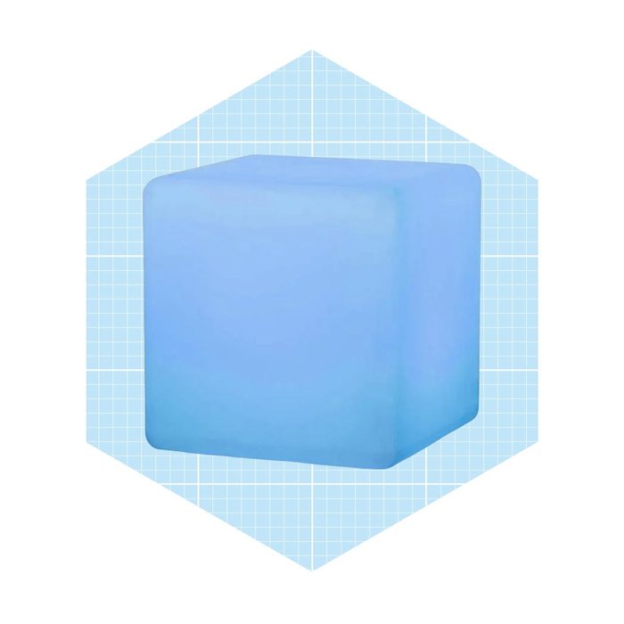 A light blue block sits centered within a hexagonal frame, featuring a grid-patterned background that enhances its three-dimensional appearance.