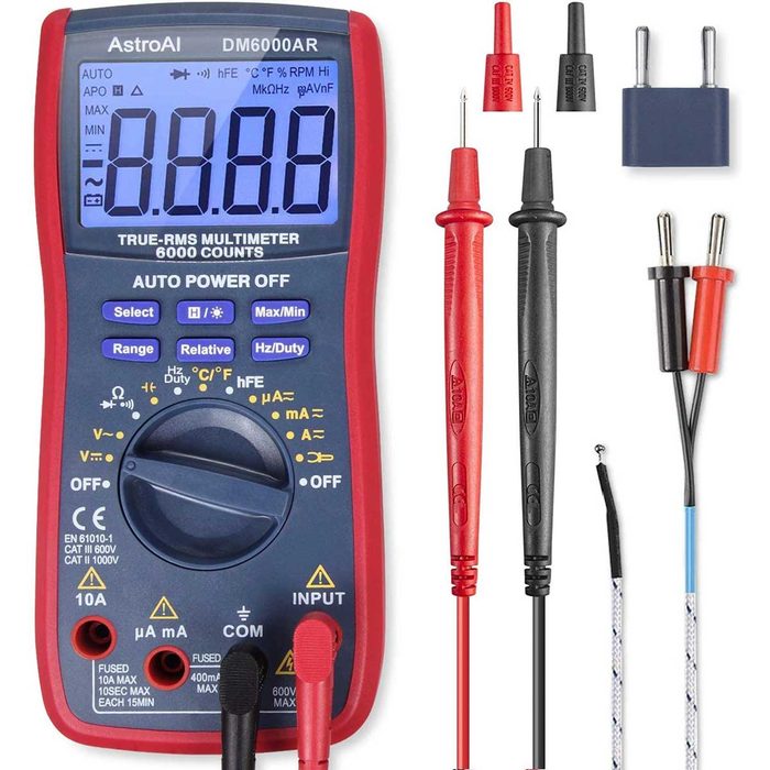 A digital multimeter displays readings while test leads are connected. Various connectors are placed alongside, indicating its use in electrical measurements.