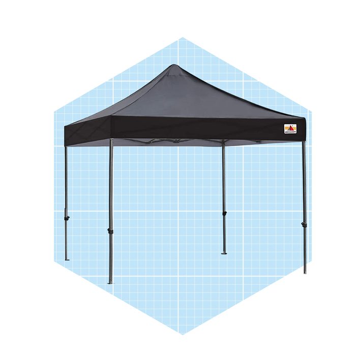 A black pop-up canopy stands upright, providing shaded shelter, set against a light blue grid background, enhancing its visibility and design.