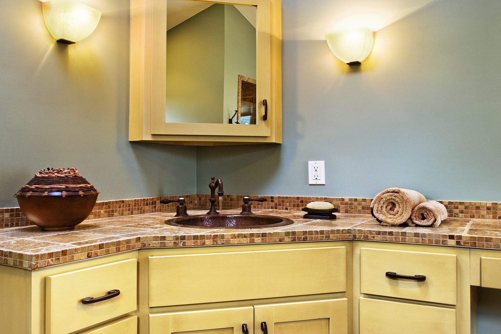 Sink and cabinets in corner of bathroom
